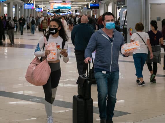 Flyers at Hartsfield-Jackson Atlanta International Airport wearing facemasks