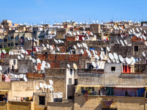 Rooftops with satellite dishes
