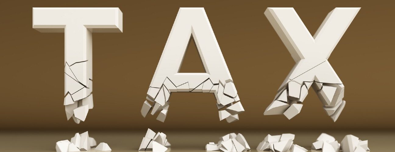 Word tax is white in 3D, broken and cracked falls on ground