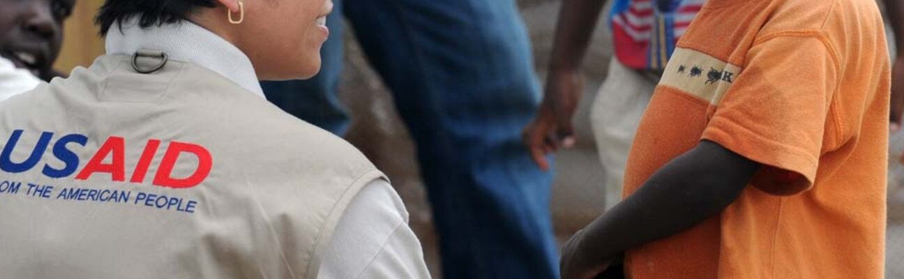 Alexandra Riboul with USAID talks with children at Tabarre Issa Emergency