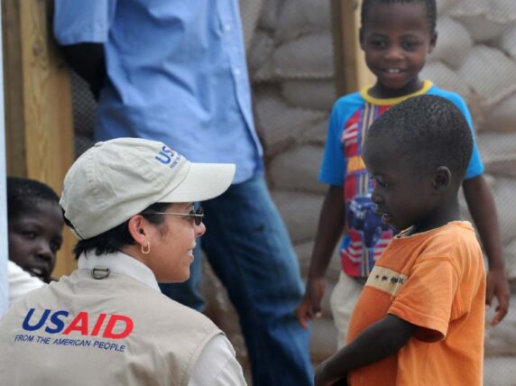 Alexandra Riboul with USAID talks with children at Tabarre Issa Emergency. Credit: Kendra Helmer/USAID